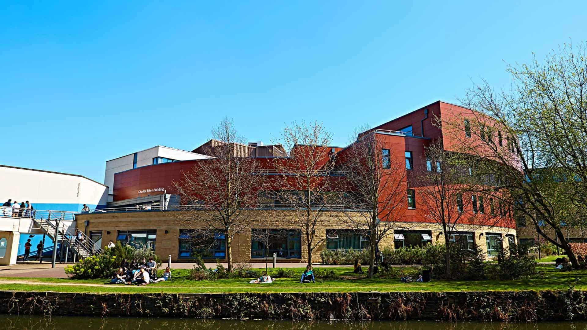 Photo of the Huddersfield Business School viewed from across the canal.